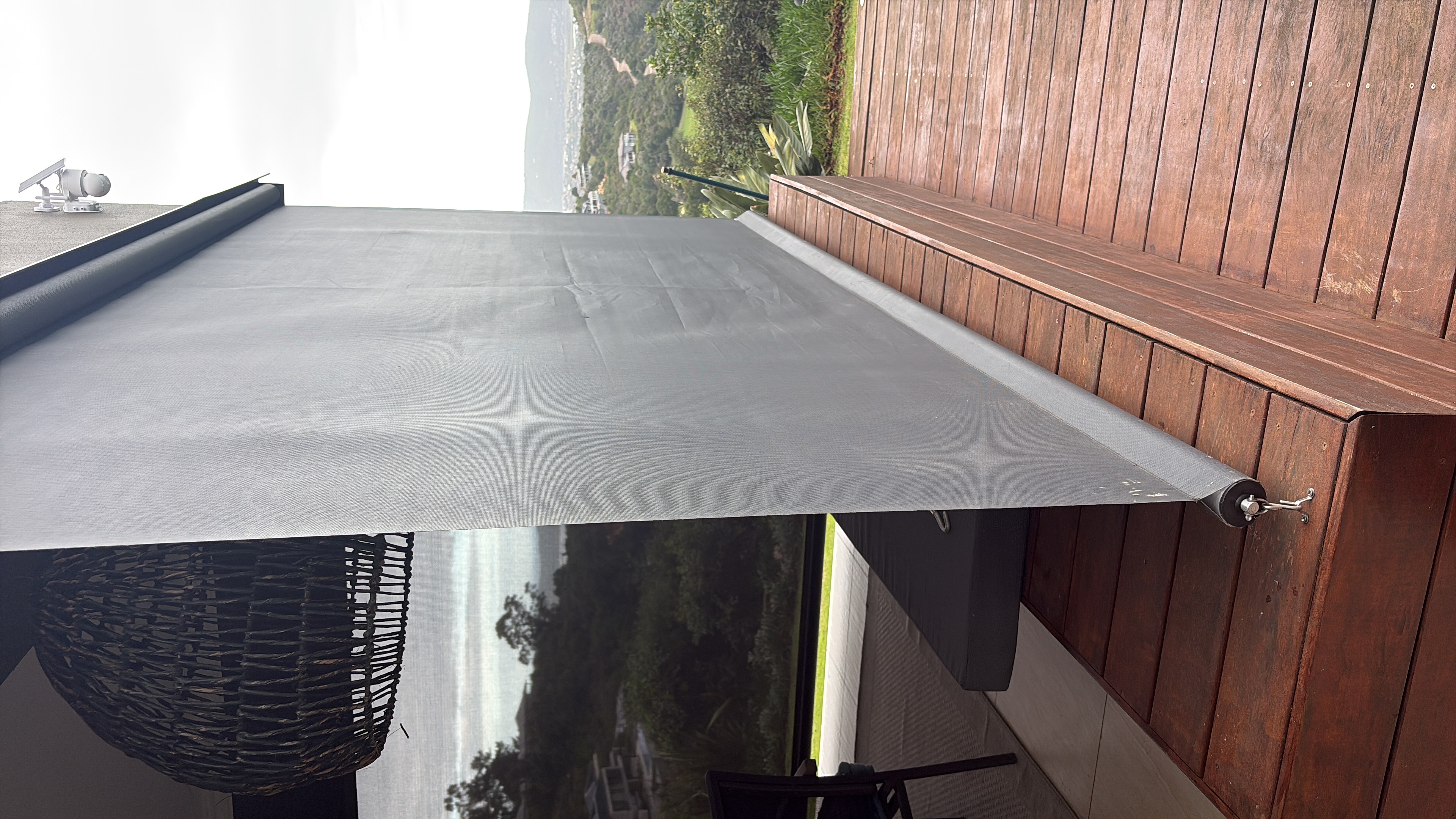 Outdoor Blinds screen in Charcoal — deck installation with valley view, South Africa