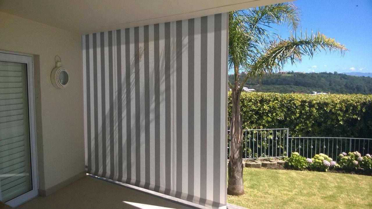 Outdoor canvas blind in grey and white stripe — balcony with mountain and garden view
