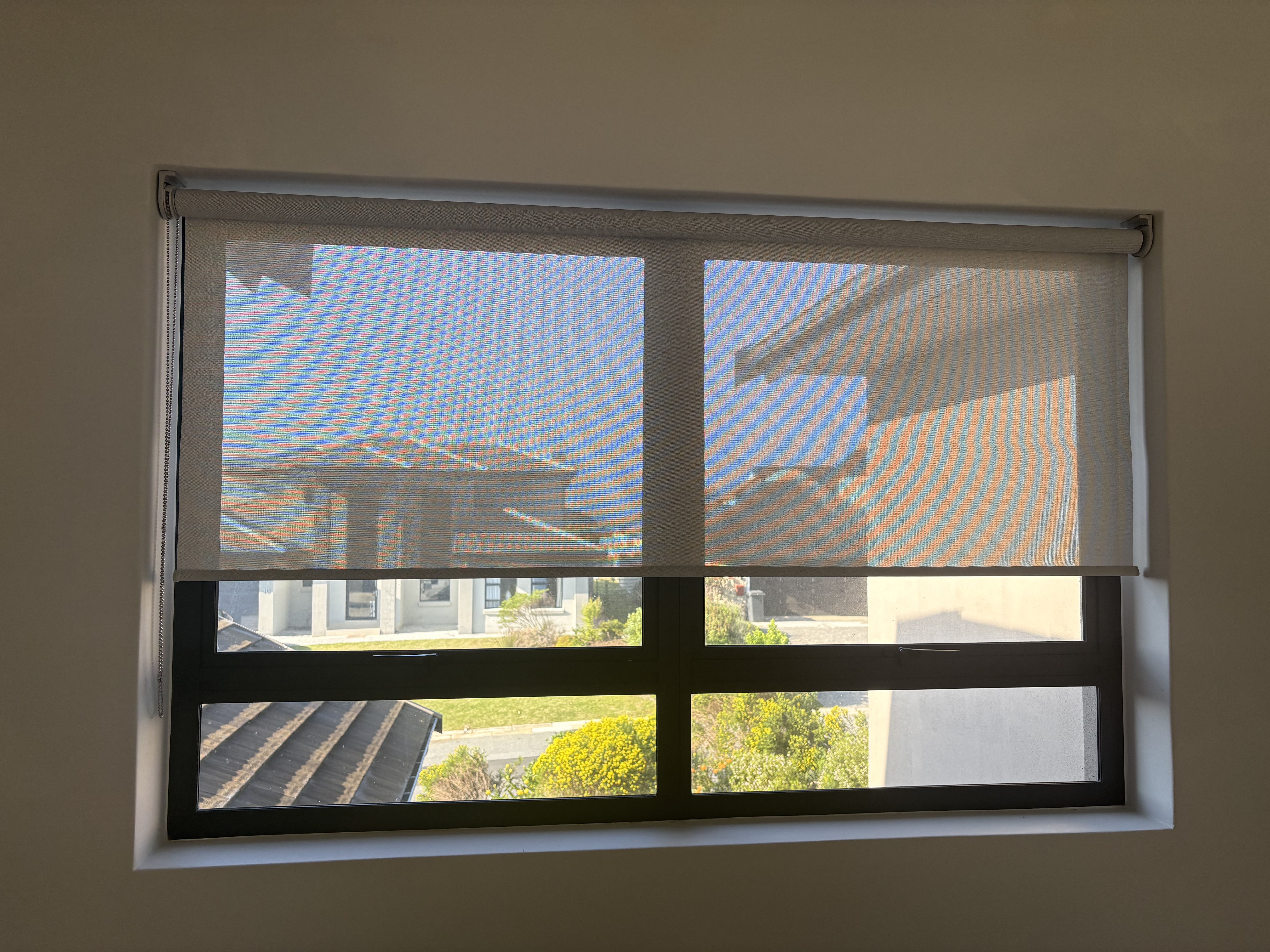 Custom Blinds White Grey sheer roller blinds on a residential window in South Africa